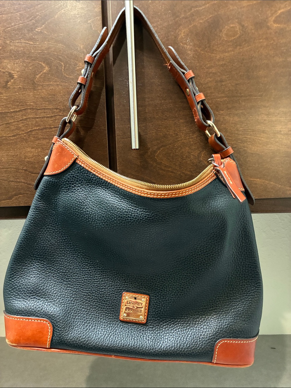 Dooney & Bourke Black Pebbled Leather Shoulder Bag with Brown Trim